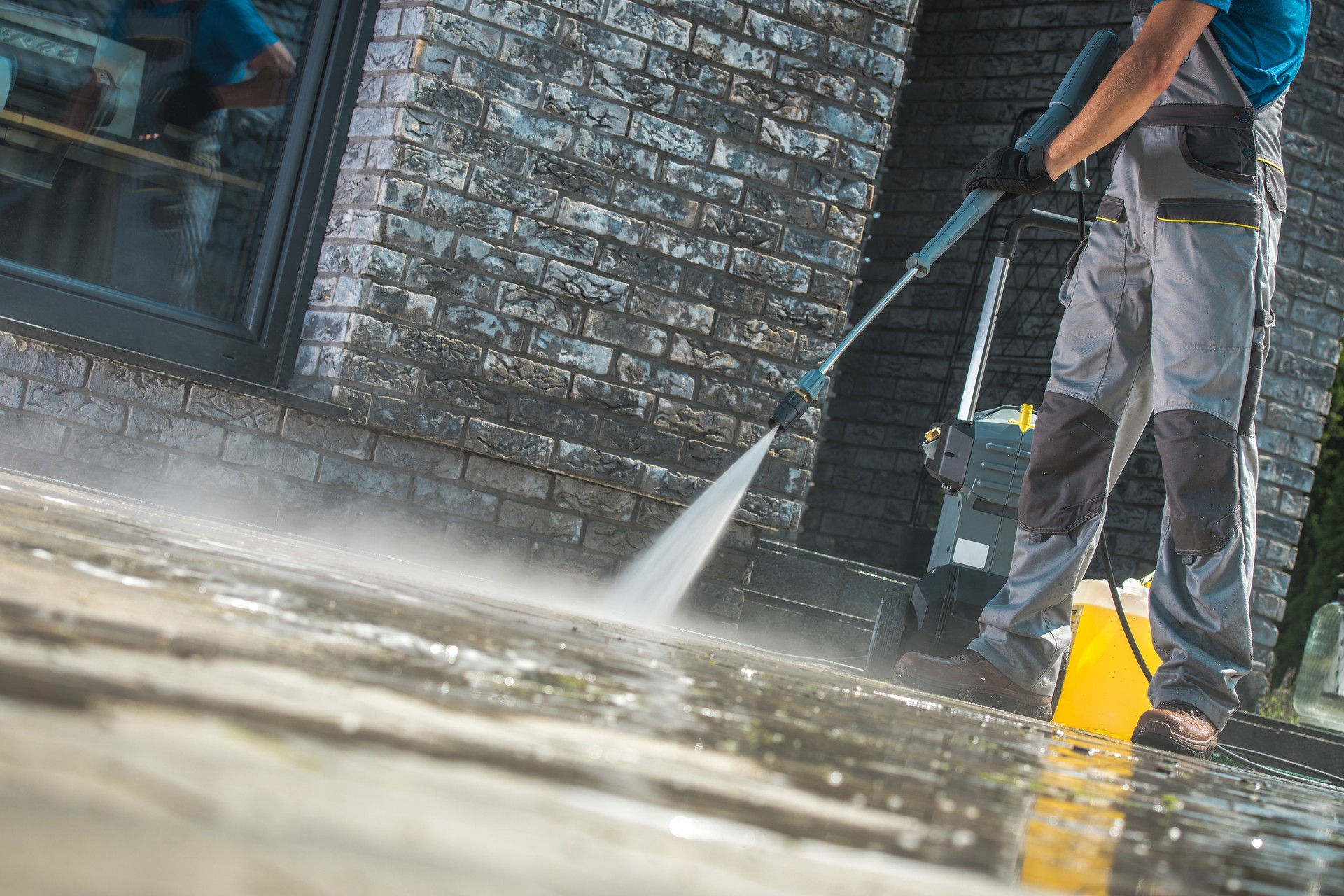 Men Washing Driveway